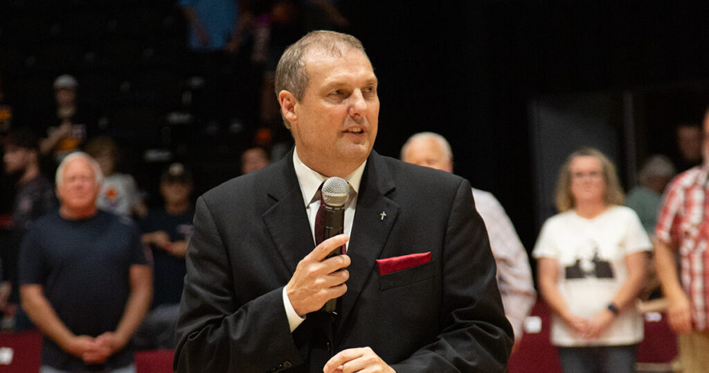 Coach Mark Dannhoff speaks to crowd