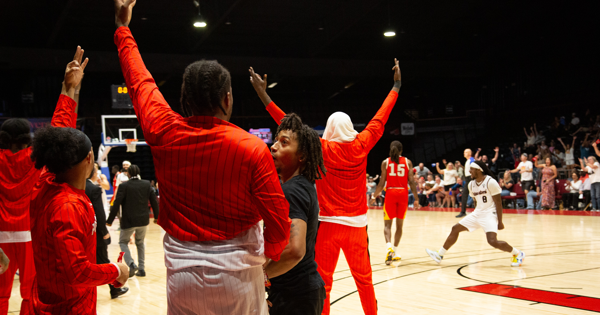 Bench celebration following Munson's half court shot